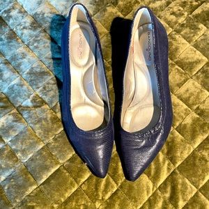 Navy, two inch heels, small patterned leather. Like new.